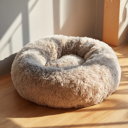 A soft, plush doughnut-shaped pet bed that is good for both cats and dogs.