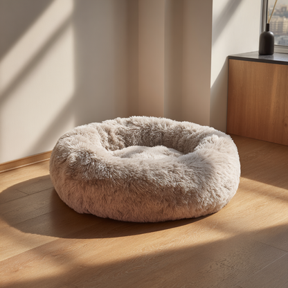 A soft, plush doughnut-shaped pet bed that is good for both cats and dogs.